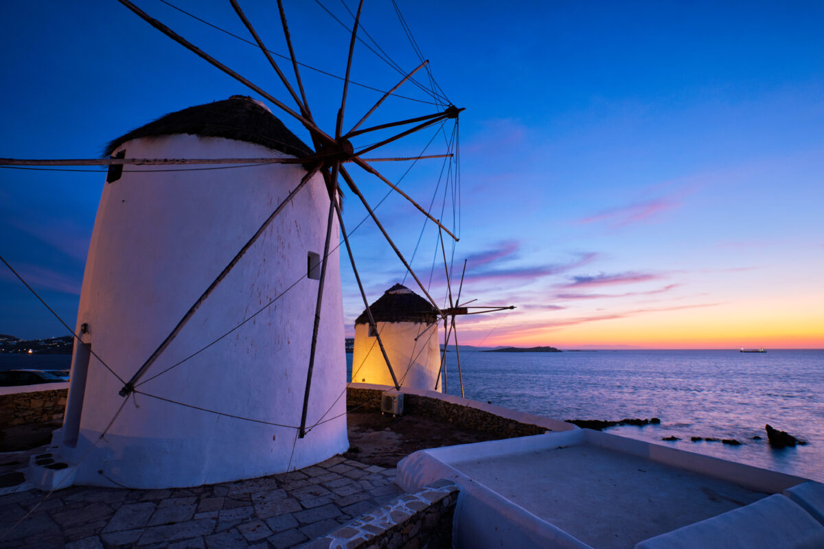 Traditional greek windmills on Mykonos island at sunrise, Cyclades, Greece